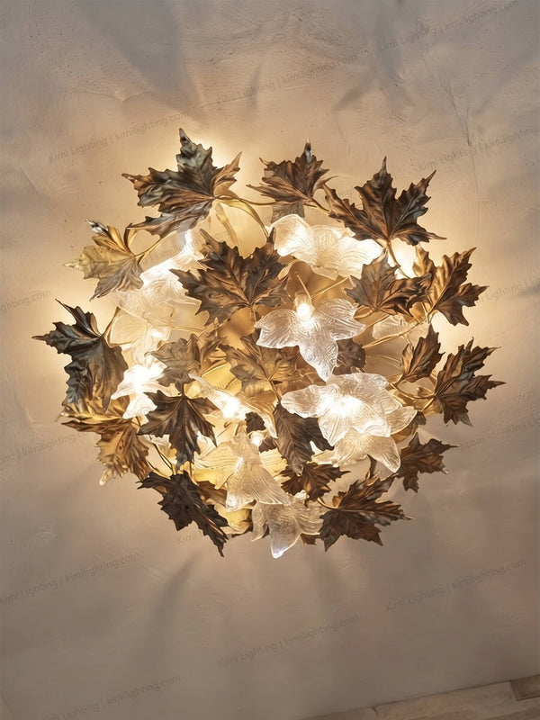 Contemporary brass leaf ceiling light enhances bedroom interiors.