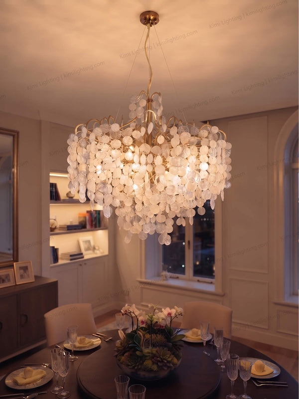 Gold glass chandelier enhances modern dining room decor