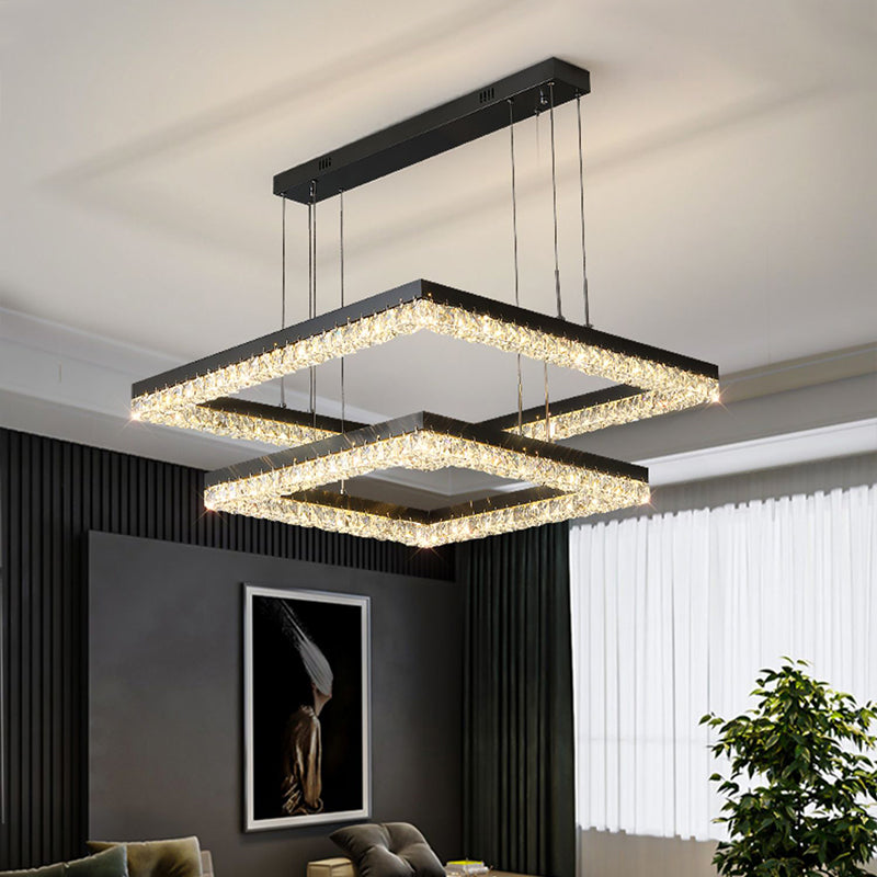 Crystal pendant lighting in a high-ceiling living room