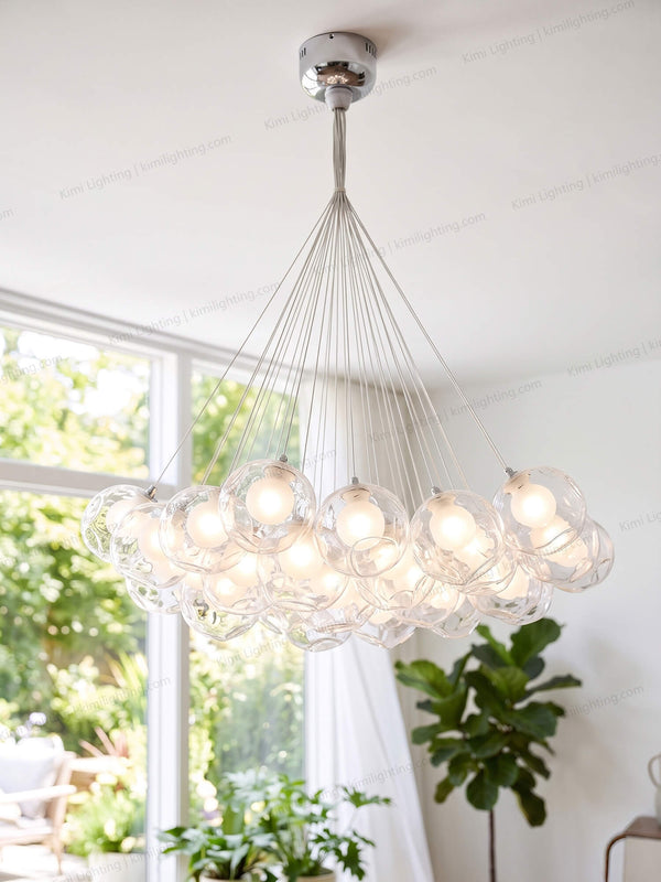 Modern glass globe pendant light enhances a stylish dining room.