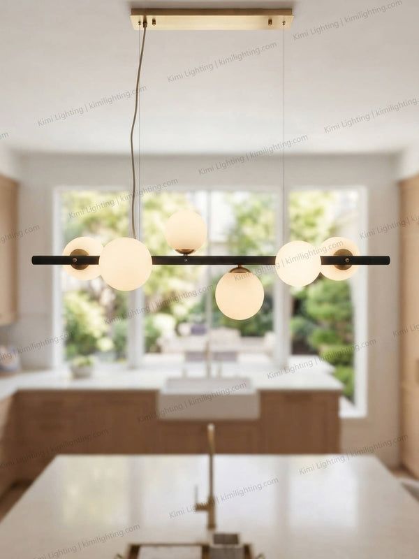Modern glass pendant light creates luxury kitchen island lighting