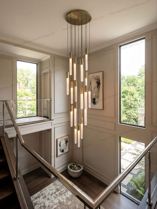 Modern gold pendant light creates elegant entryway lighting