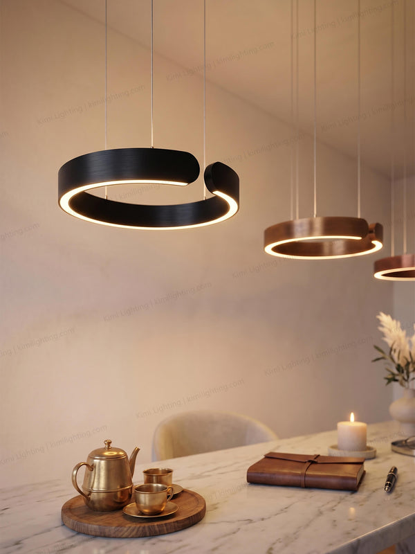 Black pendant lighting creates elegant ambiance in a lounge area.