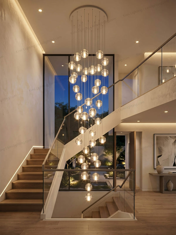 Glass pendant light creates elegant decorative lighting in a staircase.