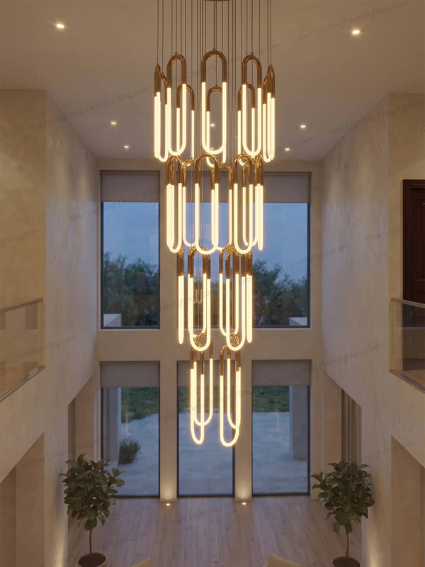Gold tube chandelier delivers elegant modern decorative lighting.
