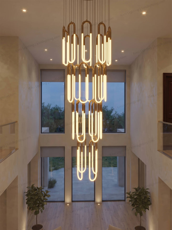 Gold tube chandelier delivers elegant modern decorative lighting.