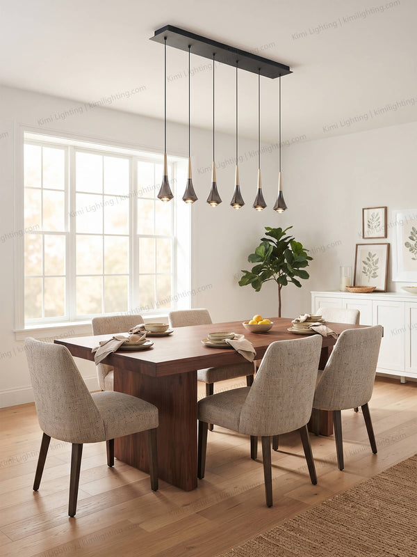 Raindrop glass pendant lighting creates elegant dining room ambiance.