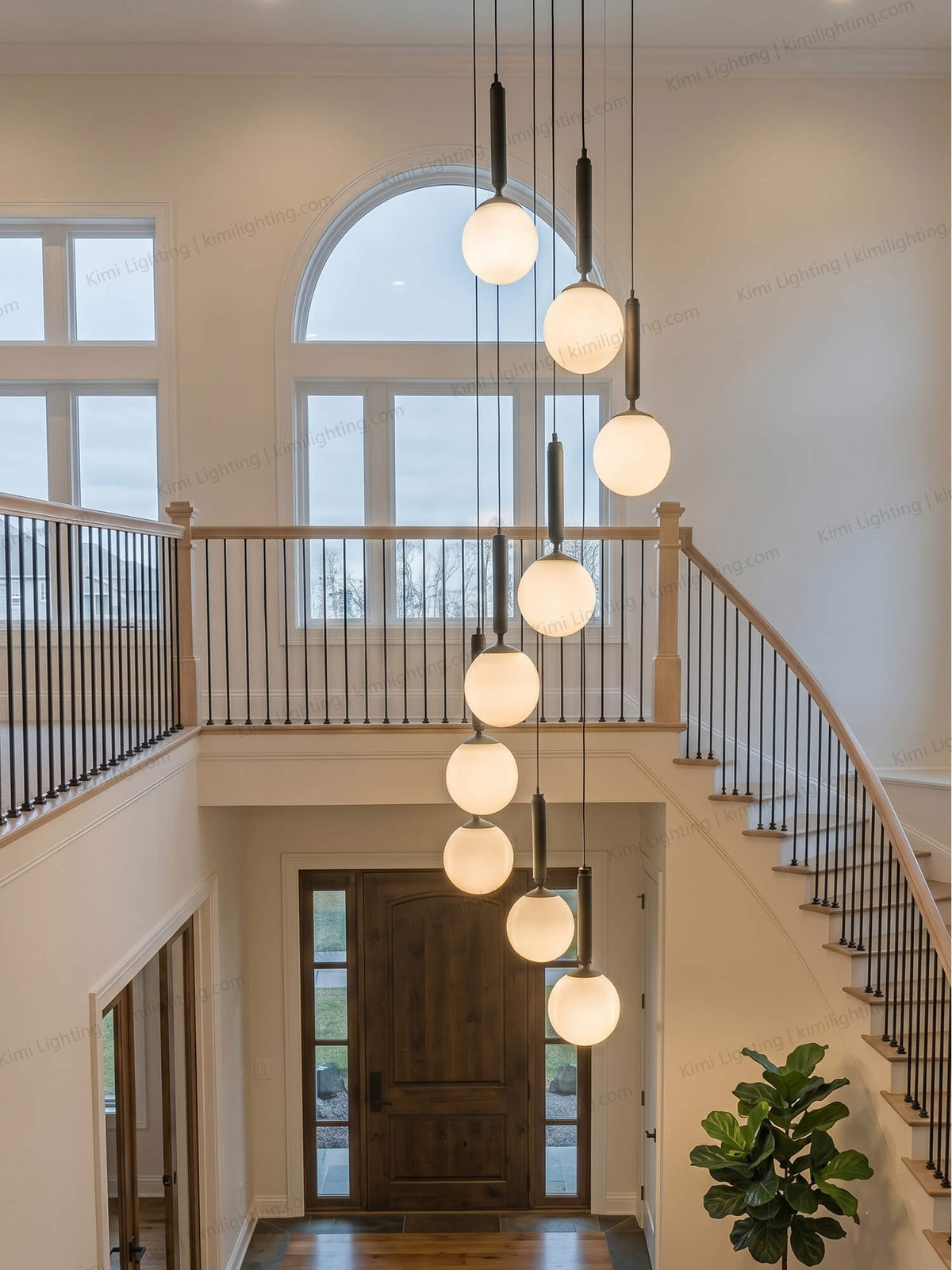 Dew drop pendant chandelier centered in a spiral staircase