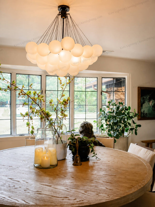 Modern farmhouse dining room featuring a glass globe cloud balloon chandelier with frosted glass spheres