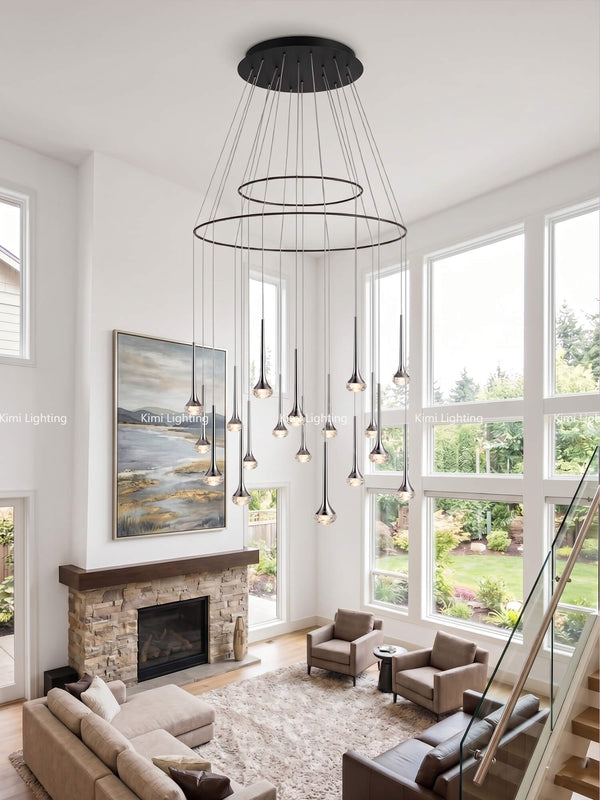 Fairy chandelier installation in a high-ceiling great room with grand and magical style.