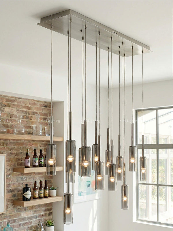 Smoky glass pendant under a modern American bistro ceiling with professional commercial style.